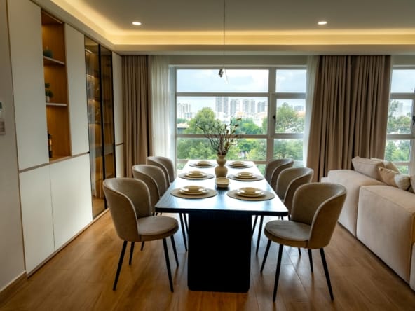 Elegant dining room with cityscape view, featuring table settings for eight.