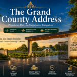 The Grand County Address premium plotted development in Sarjapura Bangalore featuring grand entrance, landscaped roads, clubhouse, and BMRDA-approved residential plots.