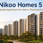 Nikoo Homes 5 resale apartments for sale in Thanisandra, Bangalore featuring premium residential towers, landscaped gardens, modern architecture, and luxury township living.