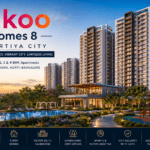 Nikoo Homes 8 Bhartiya City premium apartment township in Thanisandra with luxury clubhouse, swimming pool, landscaped gardens, and high-rise residential towers.
