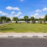 Premium residential plot for sale with wide road access in a well-developed Bangalore neighborhood.