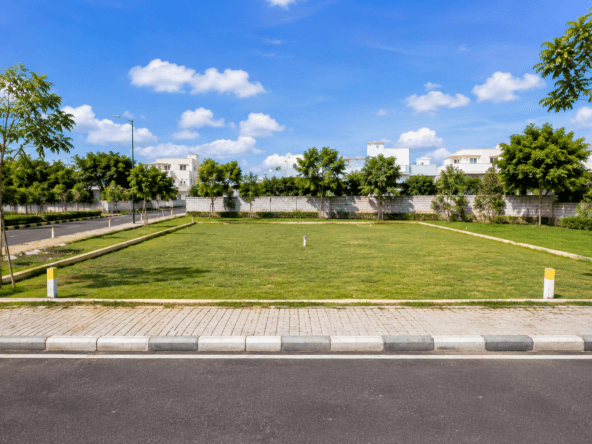 Premium residential plot for sale with wide road access in a well-developed Bangalore neighborhood.